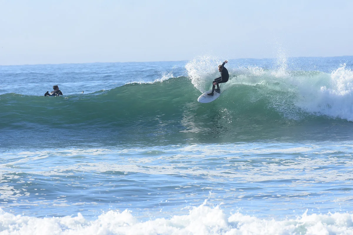 Matt surfing up the coast in 2025